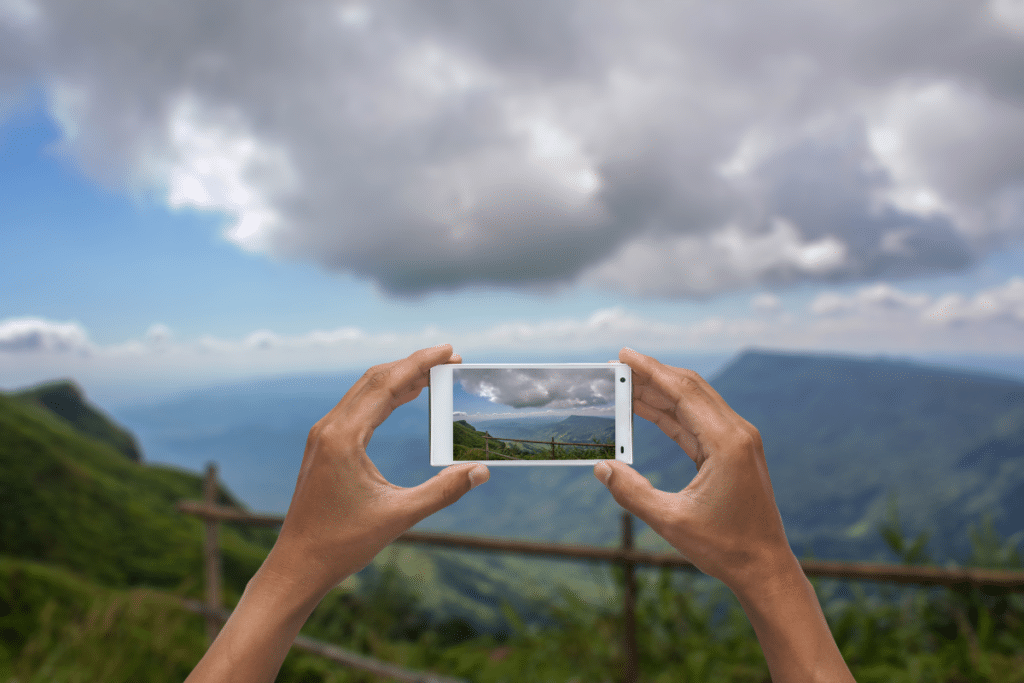 Taking picture of mountains with cell phone in Italy